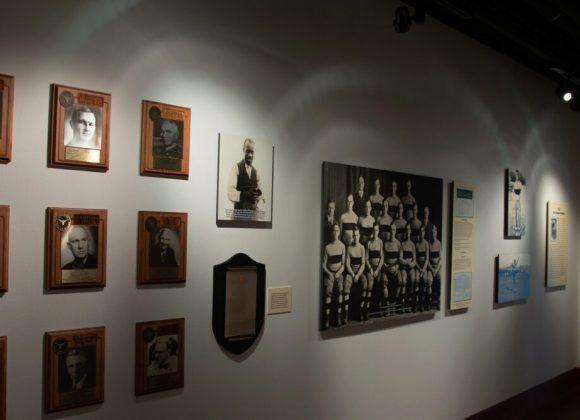 Thirteen photographs and a plaque illustrating the story of H.J. Lutcher Stark, Clyde Littlefield, and the undefeated 1914 Texas Longhorn football team, in the 1914: A Perfect Season Gallery.