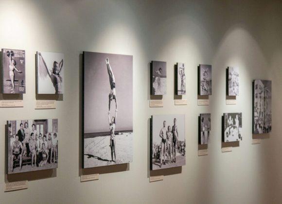 Twelve photographs, including five featuring bodybuilder and handbalancer Pudgy Stockton, with one of Stockton and bodybuilder Steve Reeves, and another Pudgy handbalancing with her husband Les, in the Muscle Beach Gallery, in the Joe and Betty Weider Museum of Physical Culture.