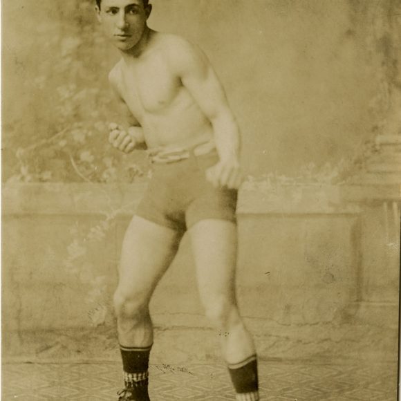 An uknown young man in boxing attire.