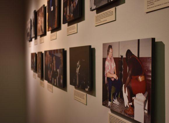 Eleven photographs of Stark Center co-founder Terry Todd, including one of Todd with wrestler and strongman Mark Henry, in the He Liked Big Things Gallery, in the main lobby.