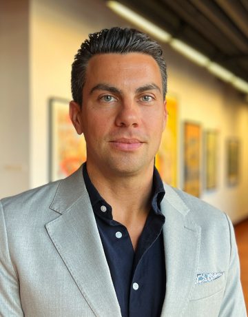 The professional headshot of curator, Kyle R M.