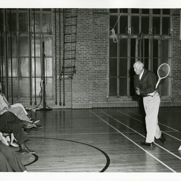 Former University of Texas tennis coach Wilmer Allison, giving a backhand demonstration, from the Wilmer Allison and Dave Snyder Tennis Collection.