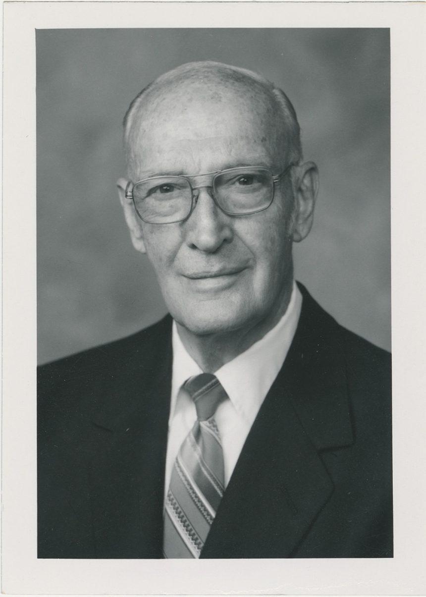 Headshot of IronMan magazine founder Peary Rader, in a suit, from the Peary and Mabel Rader Collection.