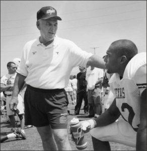 Former University of Texas football coach Charlie Craven with a Texas football player