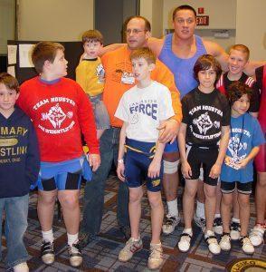 Arnold (Schwarzenegger) Strongman Classic Co-Director Steve Slater, Slater's sons Landon and Phillip, strongman Mikail Kolkyaev and several young weightlifters