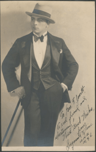 Bodybuilder Siegmund Klein in formal attire, in a photogrpah dedicated to wrestler and strongman George F. Jowett, from the scrapbooks in the George F. Jowett Collection