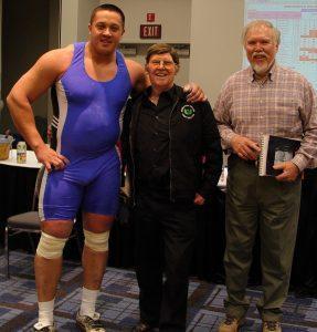 Terry Todd,Stark Center co-founder,  David P. Webster, and strongman Mikail Koklyaev after Koklyaev cleaned and jerked a 529-pound barbell at the Arnold (Schwarzenegger) Strongman Classic, in Columbus, Ohio