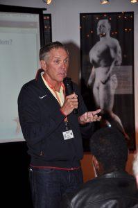 Gary Hall speaking to the 1968 U.S. Olympic Team Reunion audience in the Stark Center lobby.