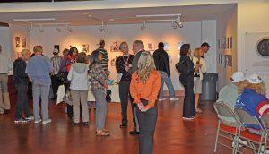 Olympians gathering and looking at the gallery