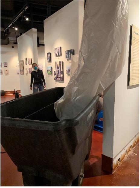 To keep the water from ruining the wall closest to it, we rigged up this plastic drape to direct the falling water into the cart.