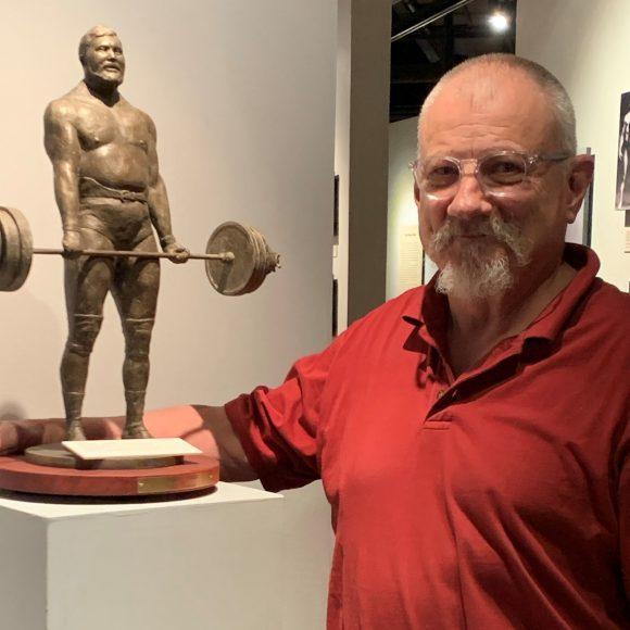 David Deming with his bronze sculpture of Terry Todd