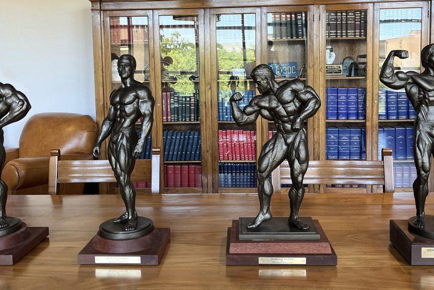 Four bronze sculptures of classic bodybuilders by David Deming