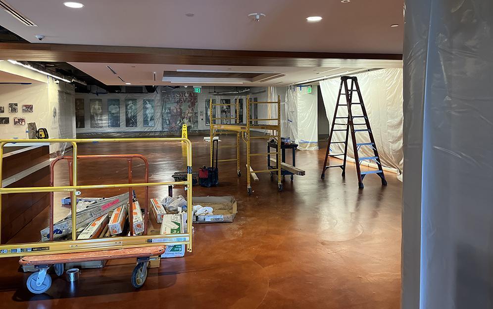 In this photo, The Stark Center lobby is covered in plastic and we see the equipment used by the crew to protect our walls and baseboards.
