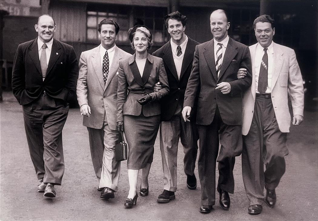 A photo of (L-R) Charles A. Smith, Joe Weider, Reg Park’s mother, British bodybuilder Reg Park, Reg’s father, and an unidentified man taken outside of the Weider offices in Jersey City.