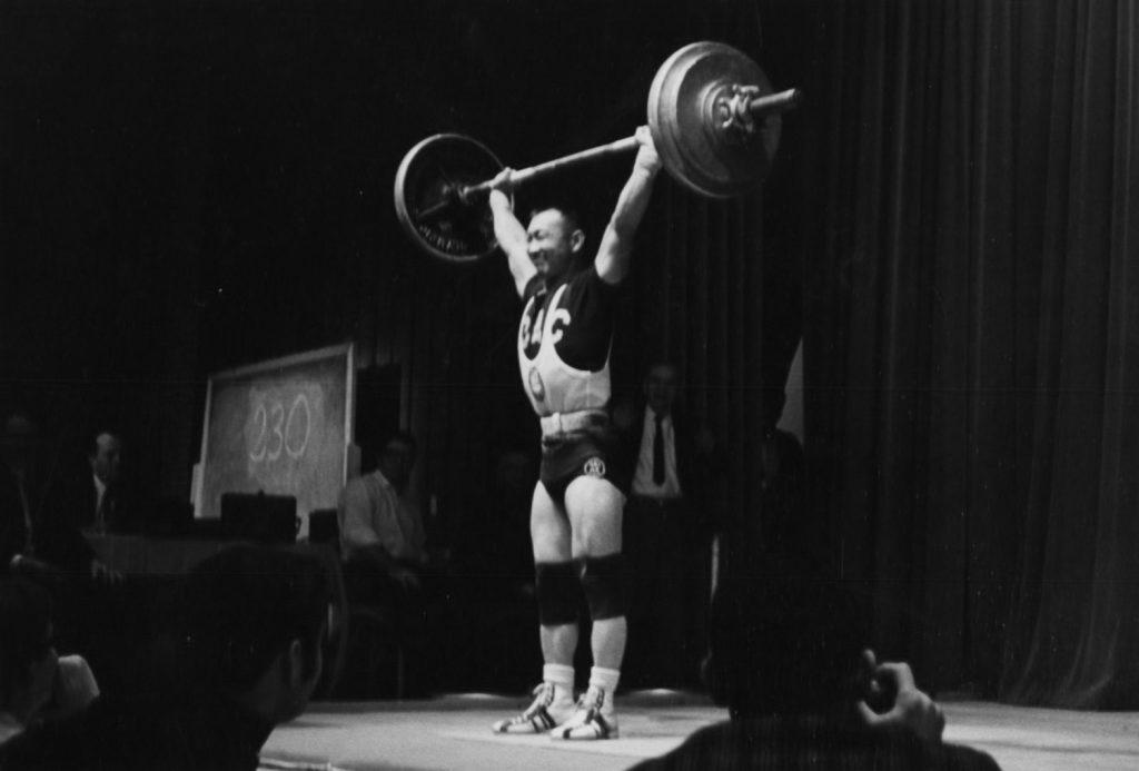 Walter Imahara completes a 230-pound snatch.