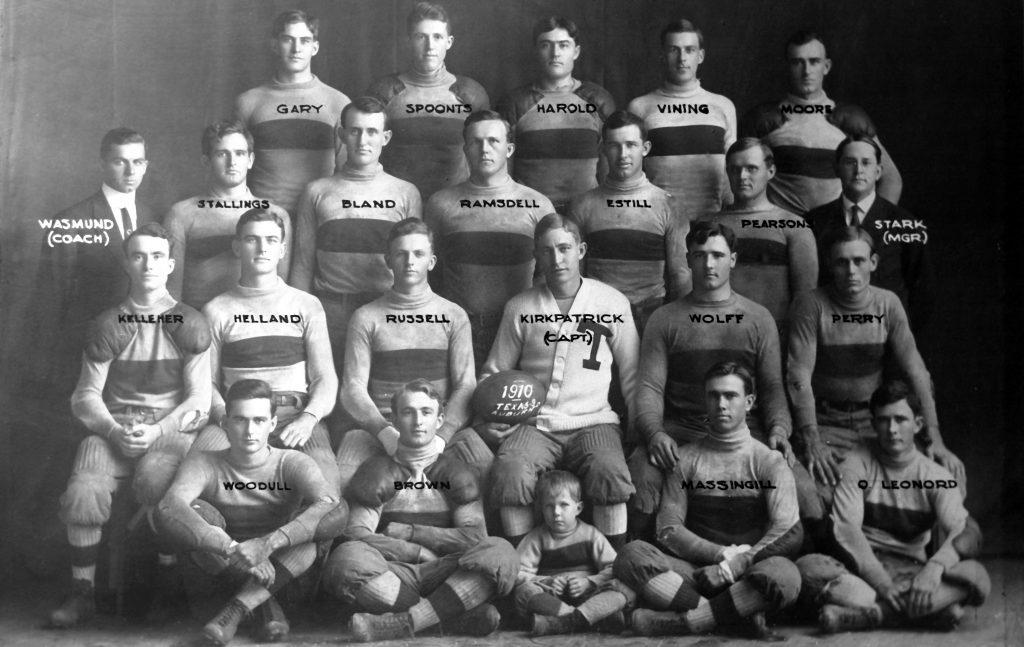 A black and white team photo of the Texas football team in 1910 with manager Lutcher Stark in the second row from the top and standing on the far right.