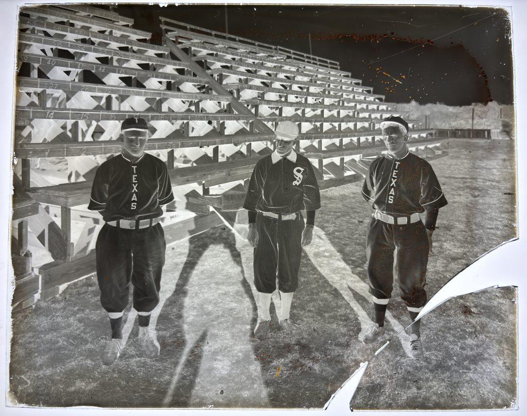 1911 glass positive plate of University of Texas men's baseball player Buford Long on left, first year coach Billy Disch in the middle, and Joe Russell on the right.