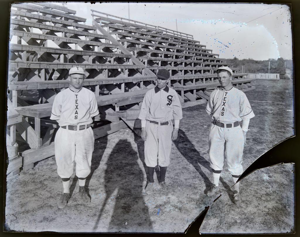 1911 image of University of Texas men's baseball player Buford Long on left, first year coach Billy Disch in the middle, and Joe Russell on the right.