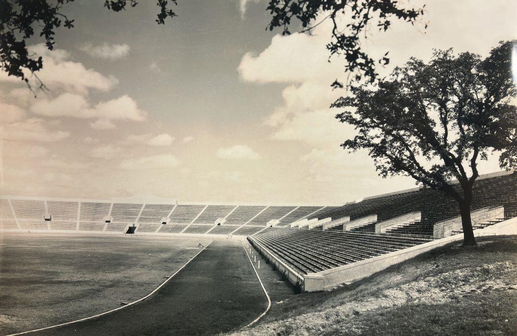 A black and white photo of Texas Memorial Stadium in 1926 when the stadium became a horseshoe-shape.