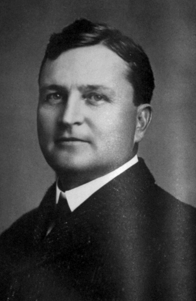 A black and white portrait of Yancey Lewis, a middle aged white man in a suit. Lewis served as Dean of the Law Department at UT from 1902-1904.