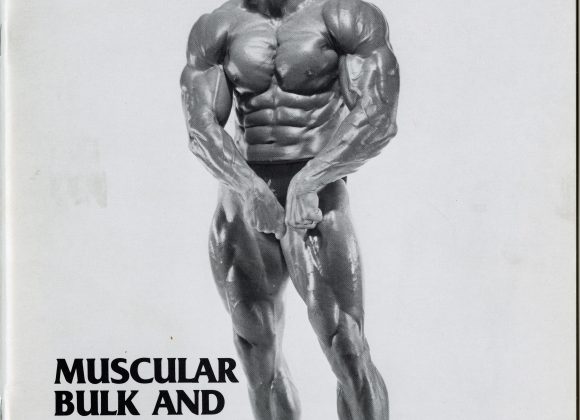 Dennis Tinerino posing on the cover of his training course Muscular Bulk and Power