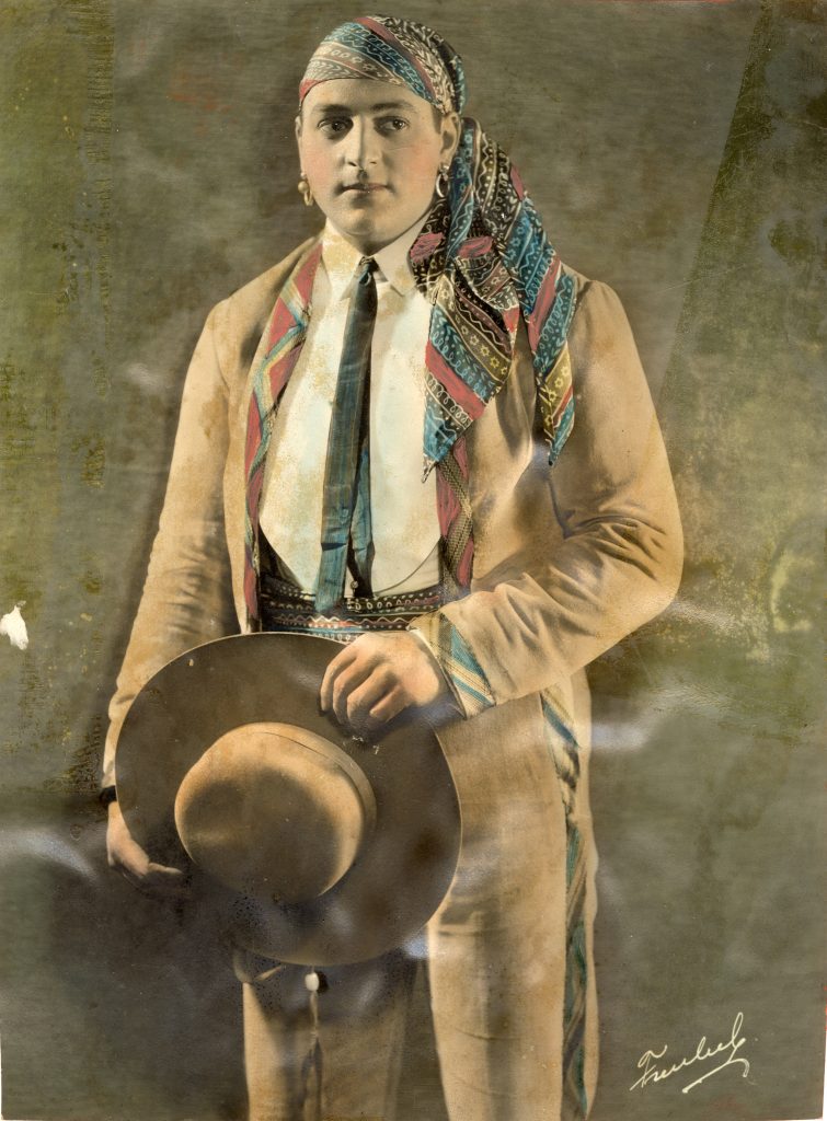 Color portrait of Joe Bonomo holding hat in his hands.
