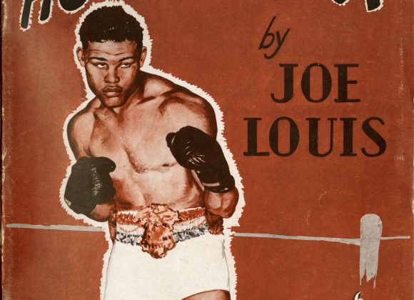 The cover of Joe Louis's booklet "How to Box." Red cover with photo of Joe Louis in a boxing stance with 50 cents.