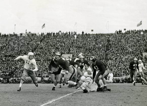 layden_pete_vs_atm_1940 copy Pete Layden #11 carries the ball vs. A&M on November 28th, 1940. Texas wins the game 7-0.