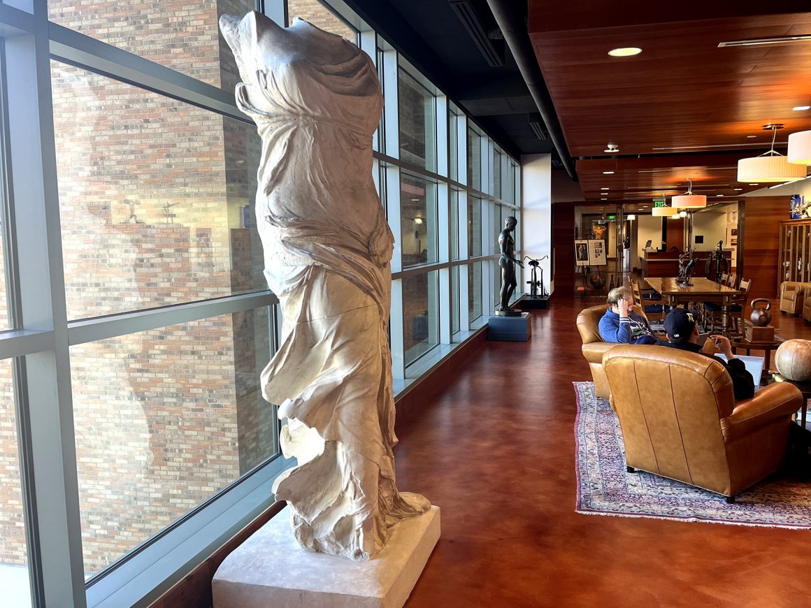 A cast of the sculpture Winged Victory of Samothrace on display in the center of the Stark Center's Reading Room.