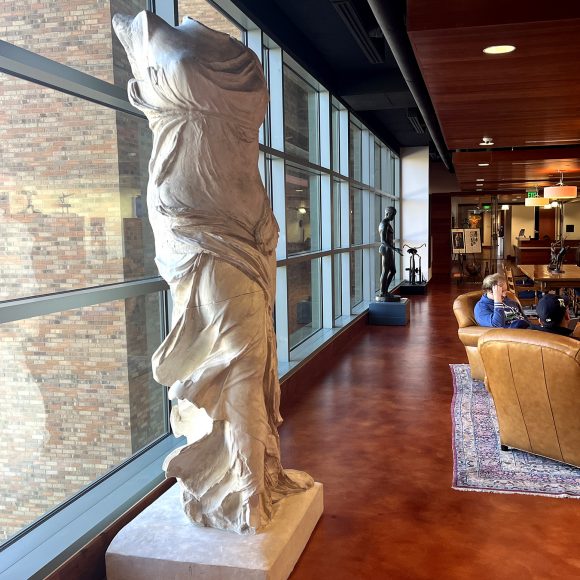 A cast of the sculpture Winged Victory of Samothrace on display in the center of the Stark Center's Reading Room.