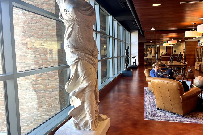 A cast of the sculpture Winged Victory of Samothrace on display in the center of the Stark Center's Reading Room.