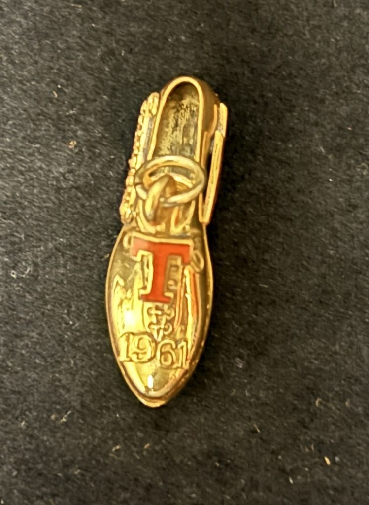 1961 Southwest Conference Track &Field track shoe with spikes golden charm top view