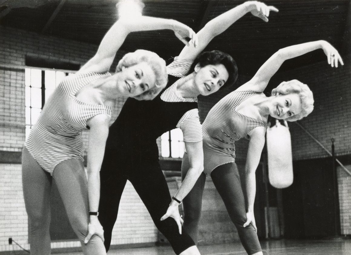 Bonnie and two unidentified women stretching.