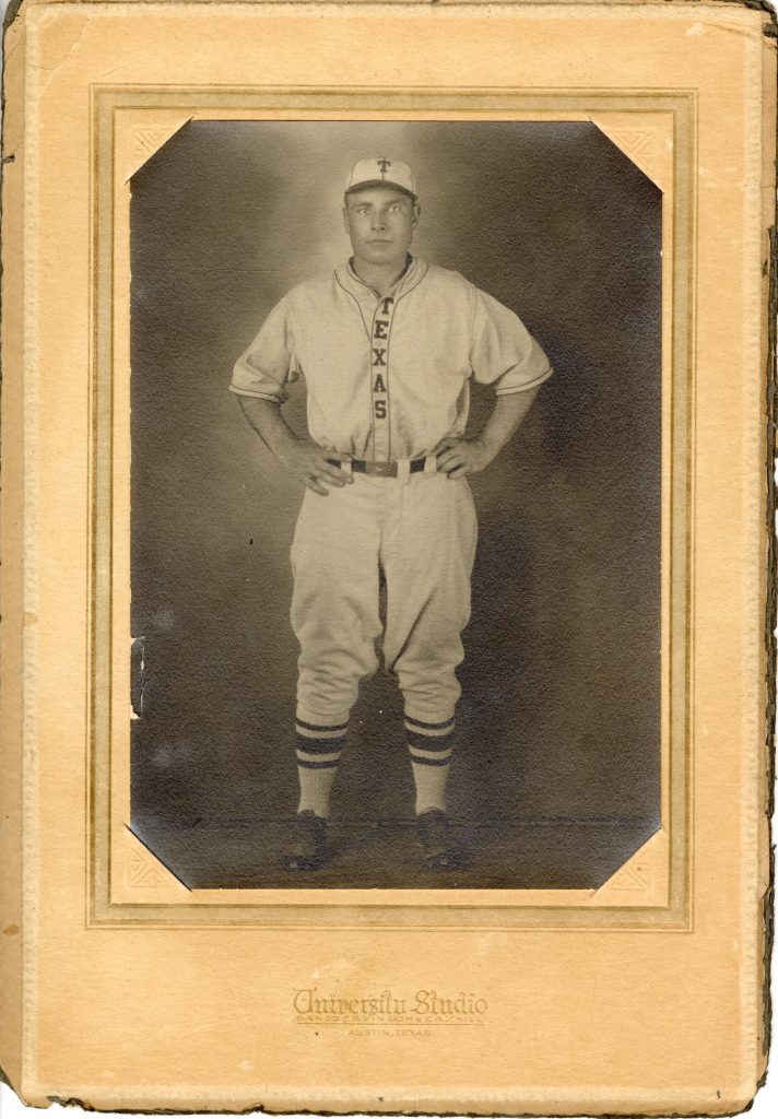 A photo of a man in a University of Texas varsity baseball uniform from 1928 secured in matting from University Studio