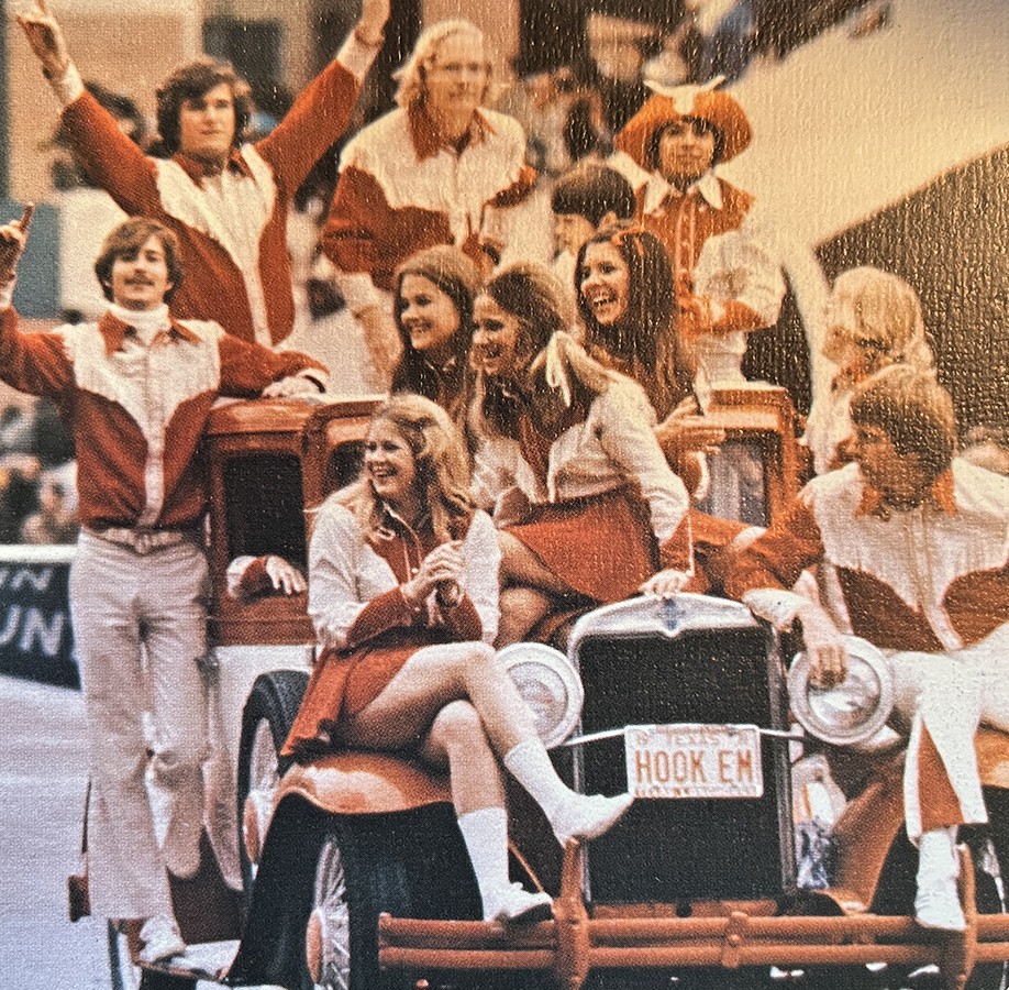 Color photo of 1972 Cheer team at University of Texas, riding on Model A car.