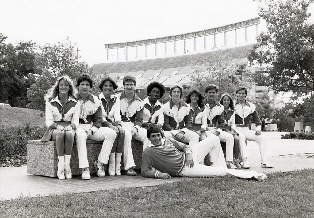 Black and white team photo of the 1983 University of Texas Cheerleading team.